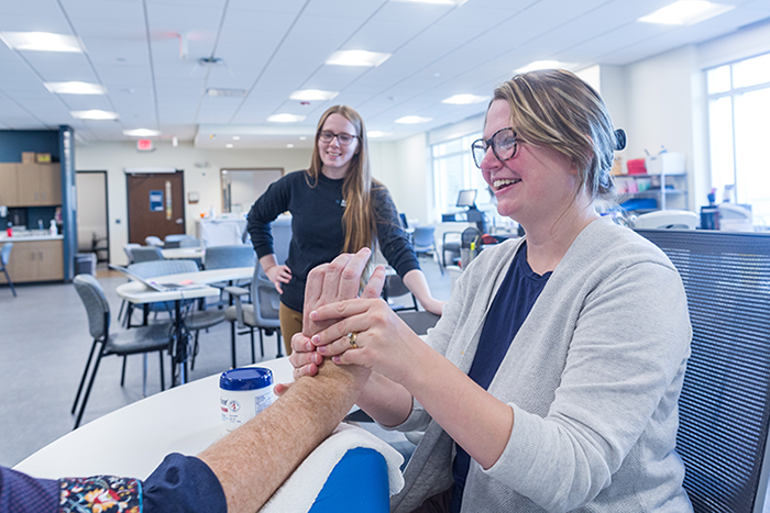 Physical therapy providers collaborating on patient care