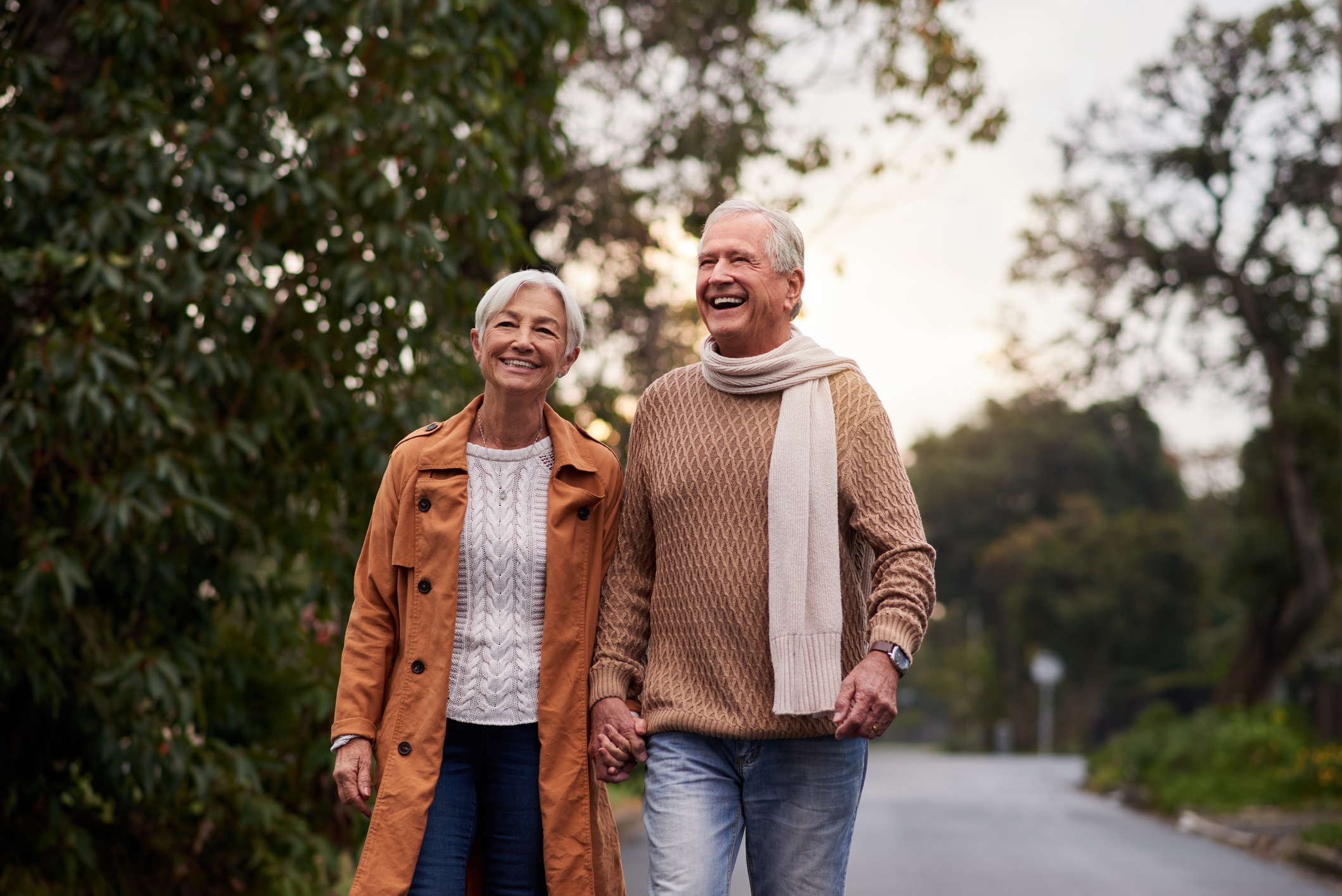 senior couple walking on a trail 