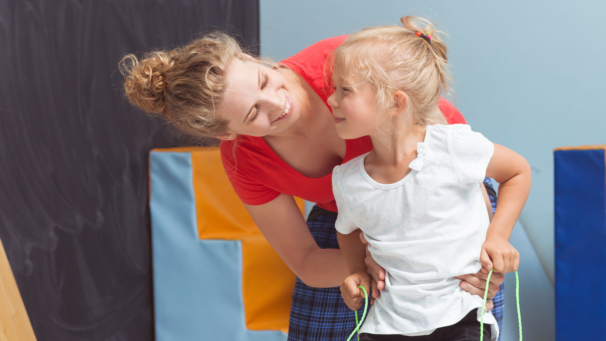 young girl with therapist