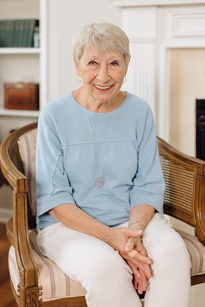 Lynn Ahlden, Riverside patient, smiling at home after heart attack recovery