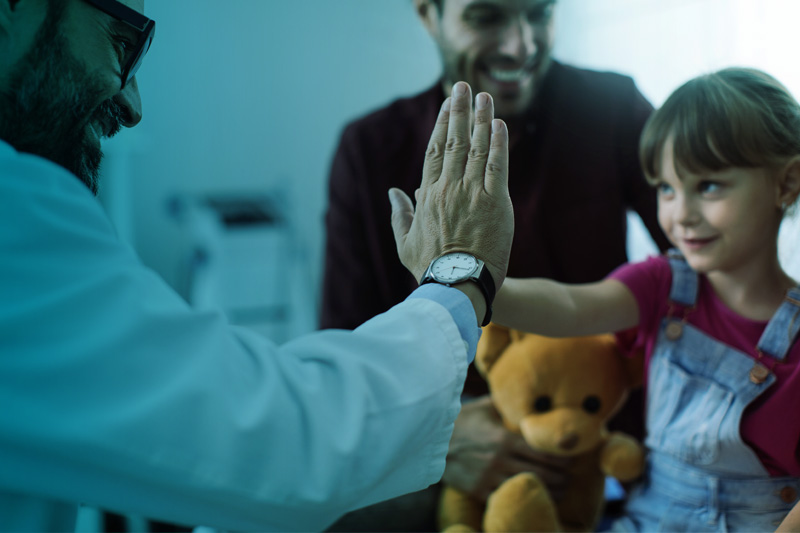 primary care doctor high-fiving new patient